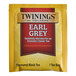 A yellow and red box of Twinings Earl Grey Tea Bags.