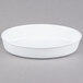 A white oval porcelain serving platter.