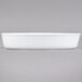 A white oval deep dish porcelain serving platter.