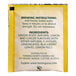 A yellow and white Twinings packet with black text reading "Lemon & Ginger" containing 25 tea bags.