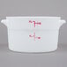 A white plastic container with red measurements and text.
