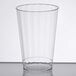 A WNA Comet clear plastic fluted tumbler on a table.