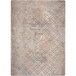 A Joy Carpets Hazelwood rectangular area rug with a beige and grey geometric pattern.