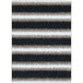 A close-up of a black and white striped rug with a brown stripe.