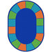 A blue oval rug with multicolored squares.