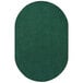 An oval forest green rug with a white border.