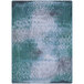 A close-up of a blue and green Joy Carpets area rug with a white pattern.