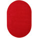 A red oval rug with a white border.