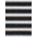 A close-up of a black and white striped rug with a brown stripe and white lines on a black background.