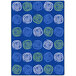 A seaglass blue rectangular area rug with white circles and green and blue swirls.