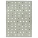 A linen area rug with grey and white dots.