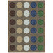 A close-up of a multicolored Joy Carpets rectangular area rug with circles and dots in brown, green, and blue.