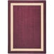 A Joy Carpets rectangular area rug with a burgundy and beige border on a white background.