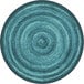 A teal round area rug with a blue spiral pattern.