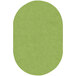 A lime green oval shaped area rug.