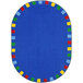 A blue oval area rug with a colorful border.