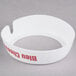 A white circular Tablecraft dispenser collar with maroon text reading "Bleu Cheese"