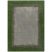 A Joy Carpets rectangular area rug with a white background and a green and gray border with a grass field inside.