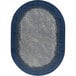 An oval marine blue rug with a blue border.