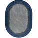 An oval marine blue area rug with a blue border.