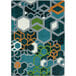 A close-up of a citrus area rug with hexagons and squares in blue, white, and black.