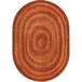 An orange oval Joy Carpets area rug with a circular design.