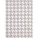 A taupe rectangular area rug with a houndstooth pattern in white.