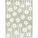 A linen area rug with grey and white big flowers on it.