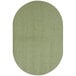 A close-up of a sage green oval rug.