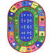 A multi-colored oval area rug with letters and numbers in white and blue.