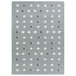A grey and white rectangular area rug with white dots.