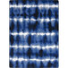 A close-up of a blue and white rug with a pattern.