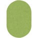 A lime green oval shaped area rug.
