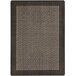 A close-up of a Joy Carpets chocolate brown rectangular area rug with a geometric design.