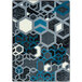 A Joy Carpets Kid Essentials area rug with a blue, black, and grey hexagon pattern.