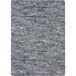 A close-up of a grey and white Joy Carpets area rug with a gray pattern.