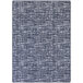 A close-up of the white Joy Carpets Impressions Past Tense rectangular area rug with a pattern of blue squares.