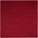 A red square rug with a white border.