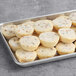 A tray of Artisan Kitchens Veggie and Three Cheese Egg White Bites on a table.