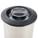 A Hamilton Beach stainless steel container with a lid.