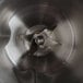 A close up of a Hamilton Beach stainless steel blender jar with a metal blade.