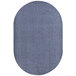 A grey oval rug with dark blue accents.