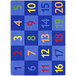 A blue rectangular area rug with yellow, white, and red numbers on it.