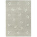 A linen rectangular area rug with white stars on a grey surface.