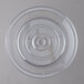A clear plastic plate cover with a hole.