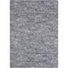 A close up of a Joy Carpets area rug with a gray and white pattern.