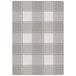 A grey and white plaid Joy Carpets area rug with a white border.