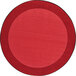 A red circle rug with a black border.