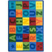 A Joy Carpets multi-colored rectangle area rug with letters and numbers on it.