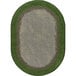 An oval area rug with a green border and grass in the center.